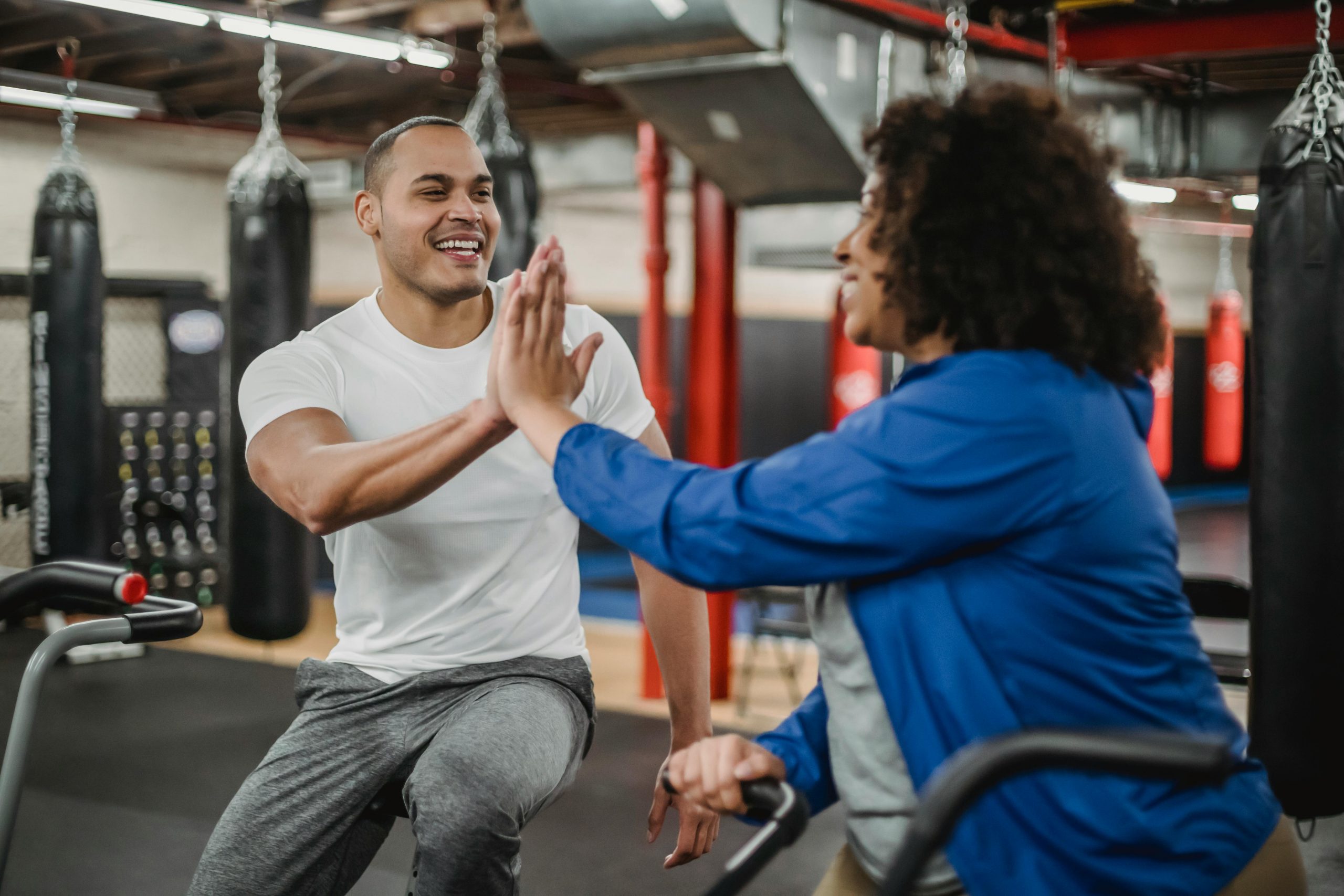 personal trainer with client high five
